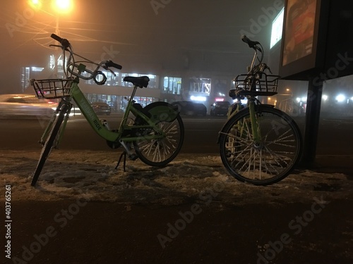 Armenia, Yerevan Komitas street. 5.01.2021. cold winter evening rental bicycles from bank INECOBANK freeze on the street