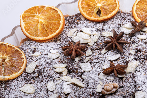 Tart with poppy seeds and fruit sprinkled with powdered sugar