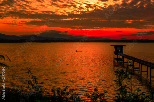 The background of the bridge stretches into the sea  with twilight light in the morning  beautiful colors  sky wallpaper and refreshing surroundings.