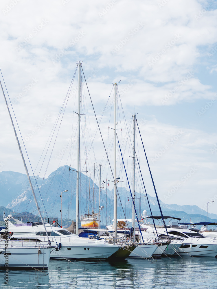 Yachts are moored at the Grand Marina, Kemer, Turkey. Beautiful ships for tourist trips on the Mediterranean sea. Yachts are moored at the Grand Marina, Kemer, Turkey. Beautiful ships for tourist trips on the Mediterranean sea.