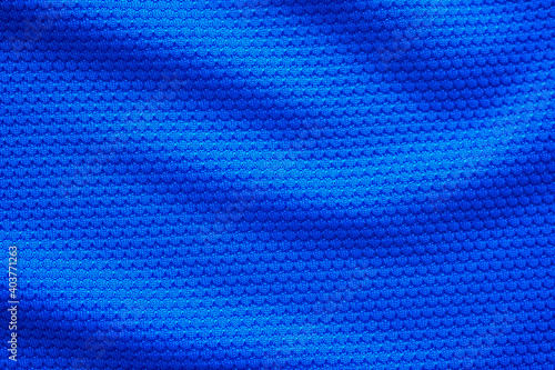 Blue football jersey clothing fabric texture sports wear background, close up top view