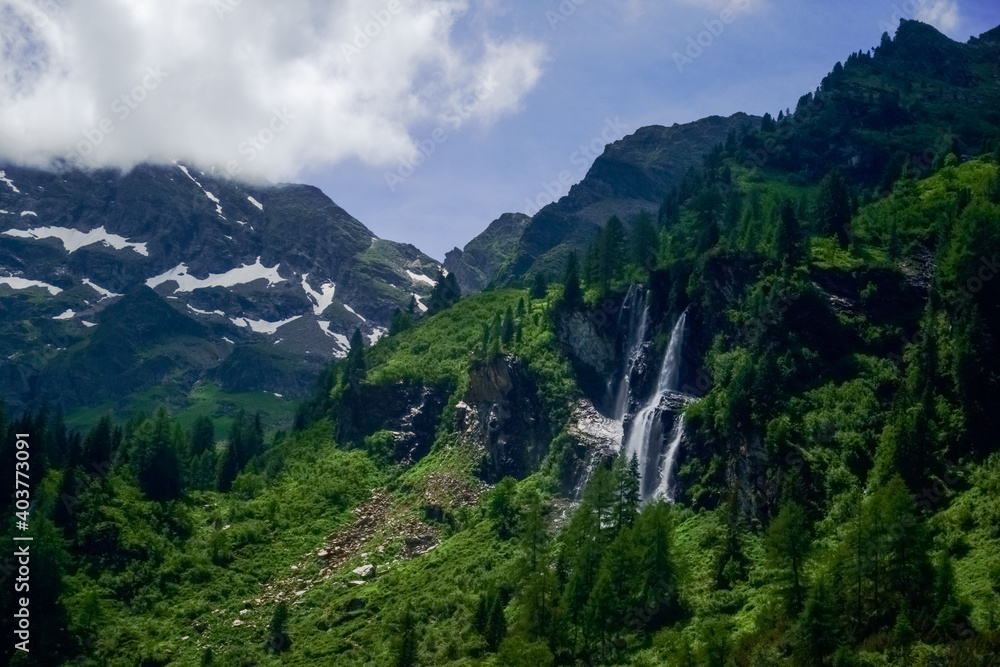beautiful waterfall on a mountain while hiking