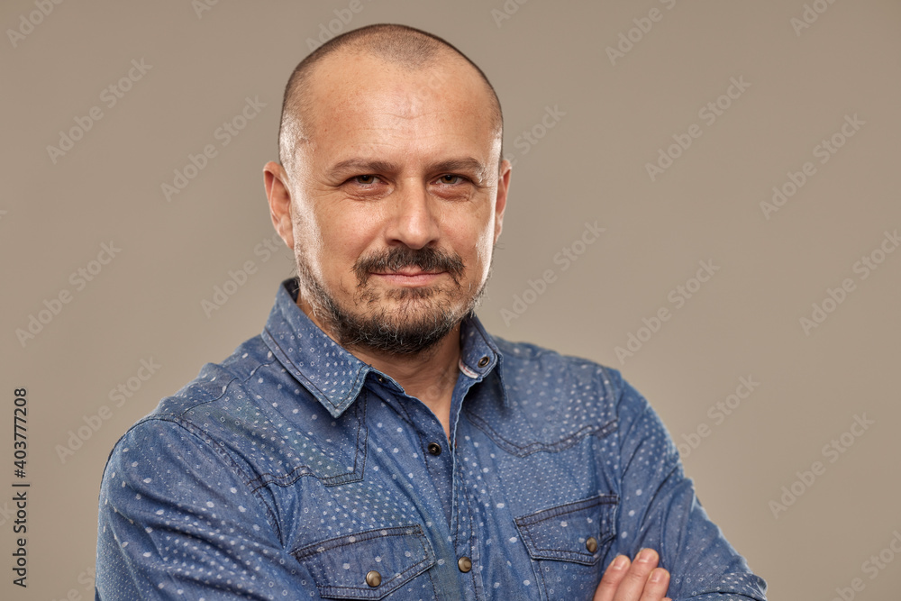Closeup of a handsome caucasian man with arms folded Closeup of a handsome caucasian man with arms folded