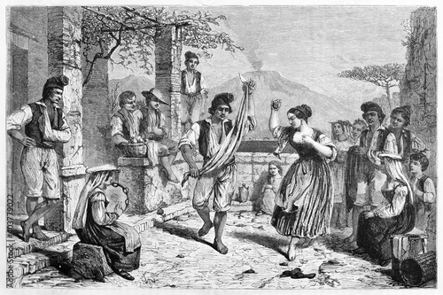 Italian people having party dancing Tarantella outdoor in traditional clothes (Neapolitan folk dance), Italy. Ancient grey tone etching style art by Bergue, Le Tour du Monde, 1861 photo