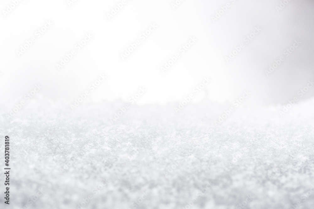Snow or snowy surface close up, winter background with snowflakes Snow or snowy surface close up, winter background with snowflakes