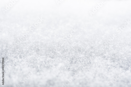 Snow or snowy surface close up, winter background with snowflakes photo