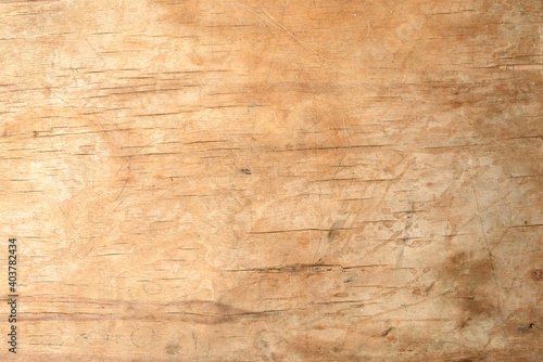 texture of a old brown wooden cutting board, full frame, backdrop for the designer