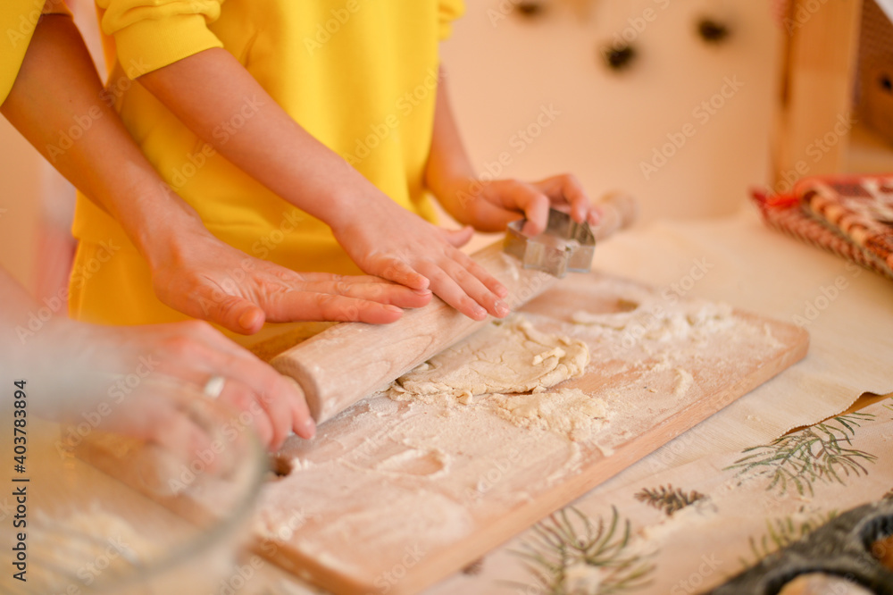 young girl is cooking cake with mother young girl is cooking cake with mother