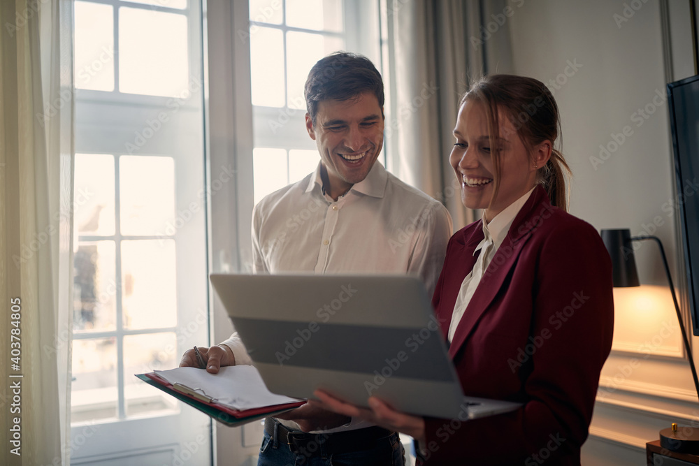 Young modern couple preparing for a business meeting Young modern couple preparing for a business meeting