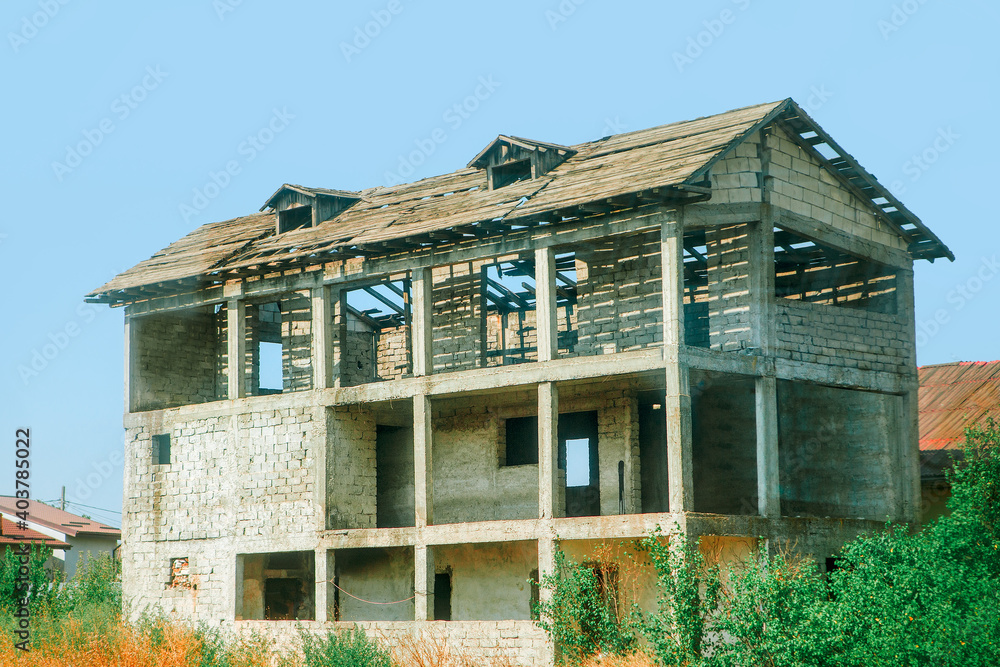 Unfinished house in the countryside . Unfinished and abandoned house Unfinished house in the countryside . Unfinished and abandoned house