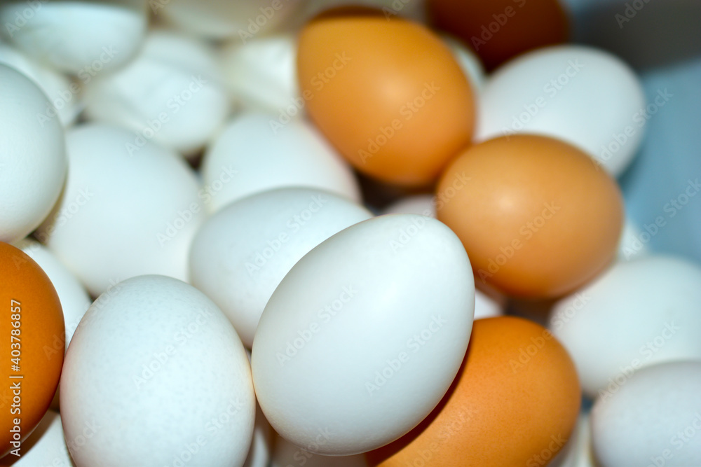 Yellow and red eggs in the refrigerator close up Yellow and red eggs in the refrigerator close up