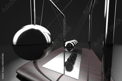 Close up of newton's cradle in action.