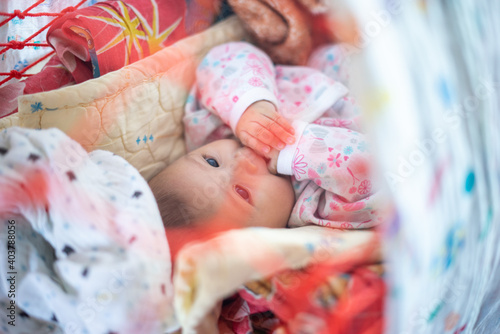 3 Month Old Baby Girl Sleeping in a Hammick photo