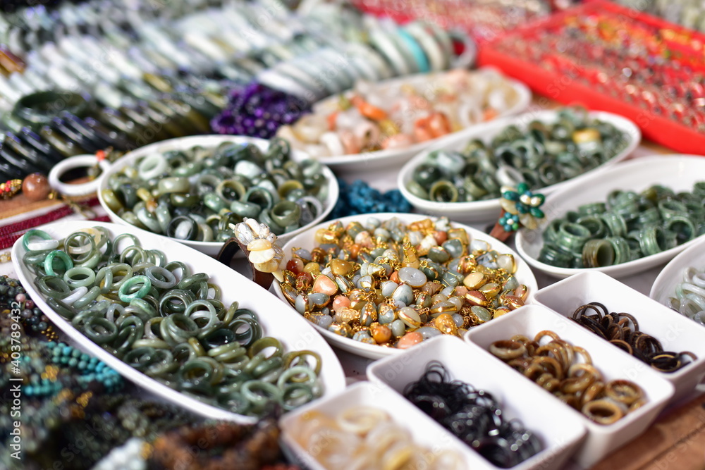 Fototapeta premium Stone and jade jewelry Beautiful traditional Mon designs at Mon Market, Sangkhlaburi District, Kanchanaburi Province, Thailand