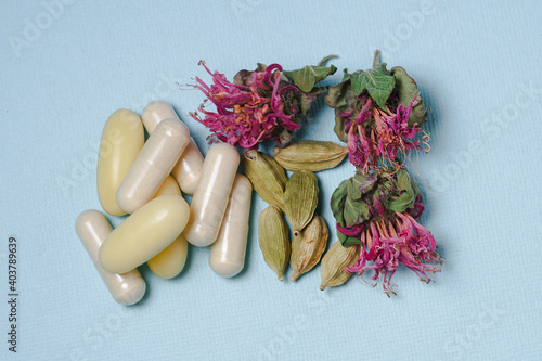The concept of alternative medicine. A pile of medicinal herbs and pills.