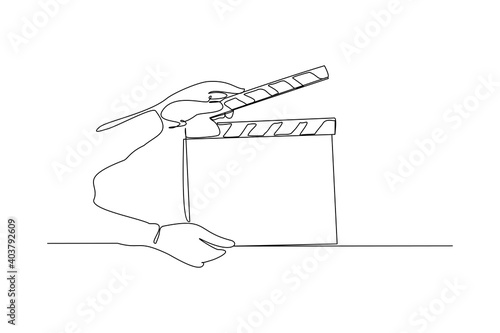 Continuous line drawing of hand hold retro old classic movie board clapper. Vintage film scene taker item concept single one line art design graphic vector illustration