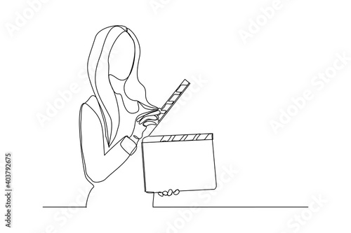 Continuous line drawing of woman hold retro old classic movie board clapper. Vintage film scene taker item concept single one line art design graphic vector illustration
