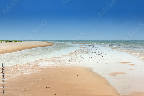 Fototapeta Naklejka Na Ścianę i Meble -  Empty sandy beach near Norra Austen on the Swedish island Fårö in the Baltic Sea in summer. Long-term exposure