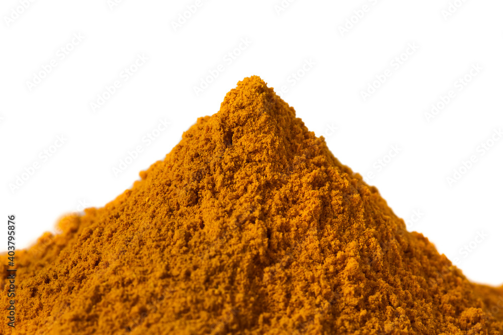 Heap of turmeric powder spice isolated on a white background.