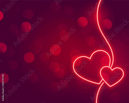 romantic neon hearts glowing on bokeh background