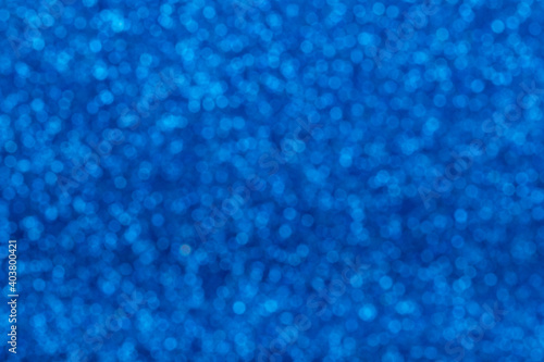 Defocused Natural Glitter Lights Bokeh. Abstract Pattern Blue Sea Navy Texture Background