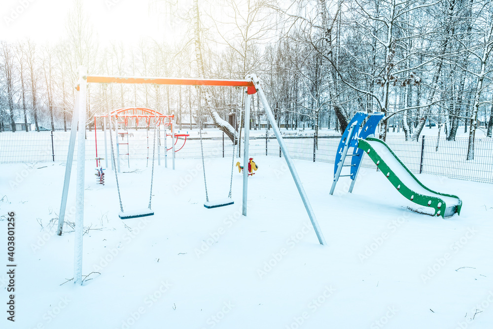 Empty playground in winter after snowing Empty playground in winter after snowing