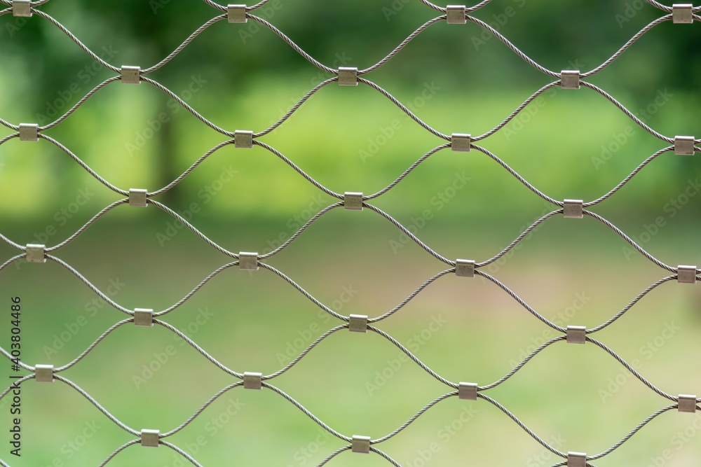 Fototapeta premium Braided wire fence - close-up photography