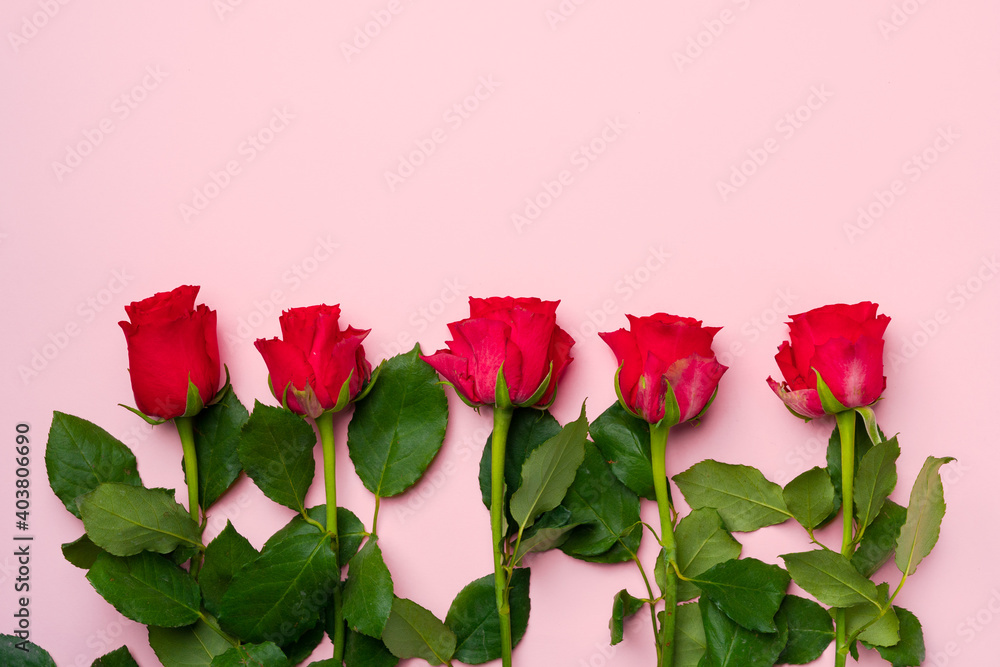 Bouquet of roses on pink background top view Bouquet of roses on pink background top view