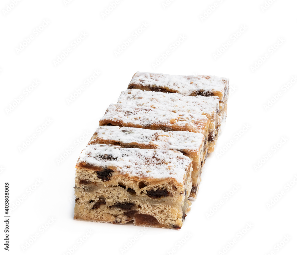 Christmas stollen slices with icing sugar isolated on white Christmas stollen slices with icing sugar isolated on white
