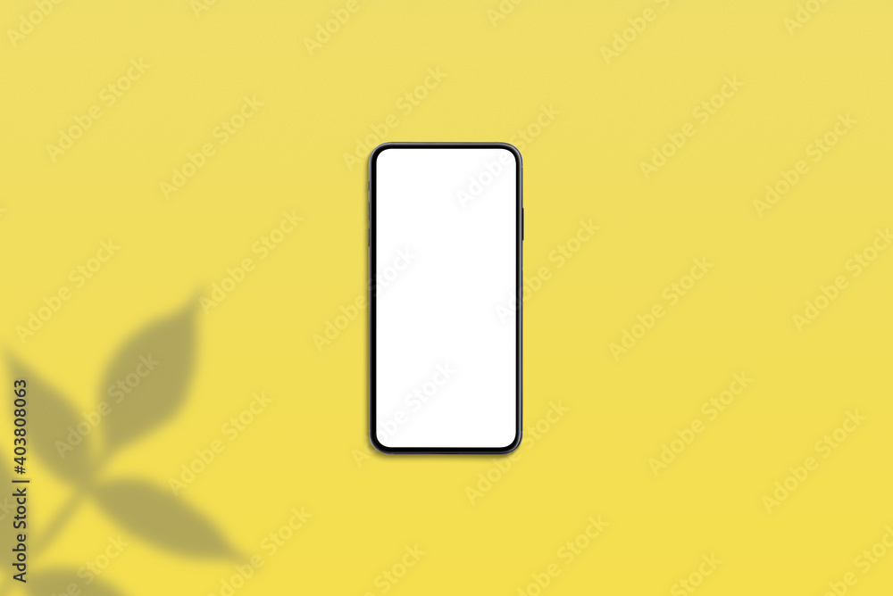 Phone mockup on yellow desk with plant shadow beside Phone mockup on yellow desk with plant shadow beside