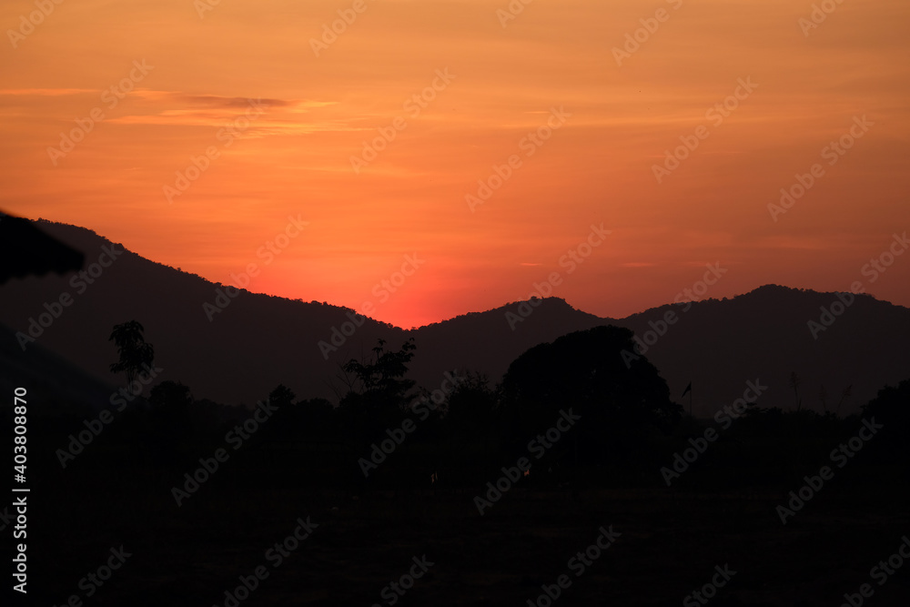 View of the yellow-orange sky near the dark or near the morning light. Little sharpness