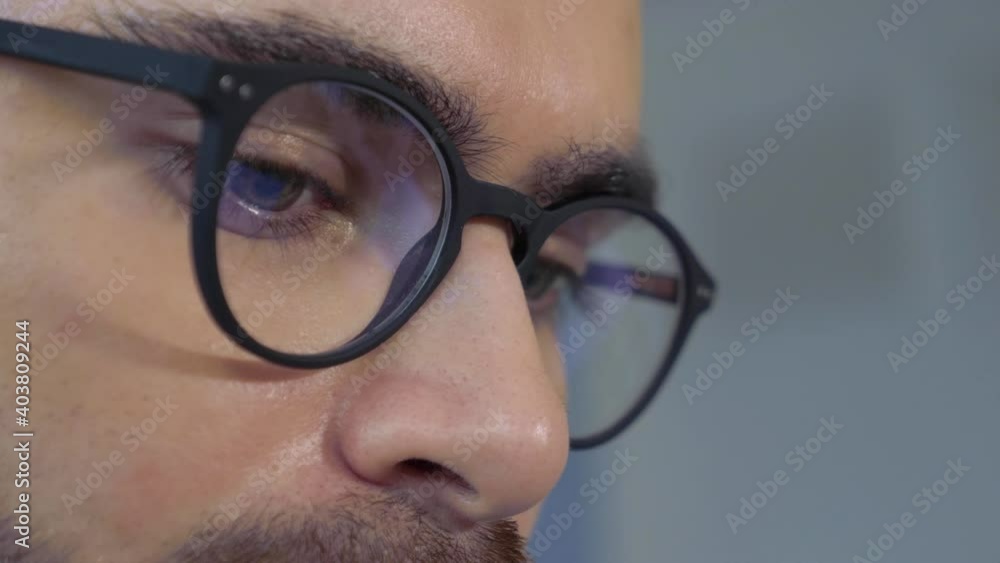Close-up of A Man Businessman with Glasses Reflection Of the Computer Monitor Screen Working Online At Home Close-up of A Man Businessman with Glasses Reflection Of the Computer Monitor Screen Working Online At Home
