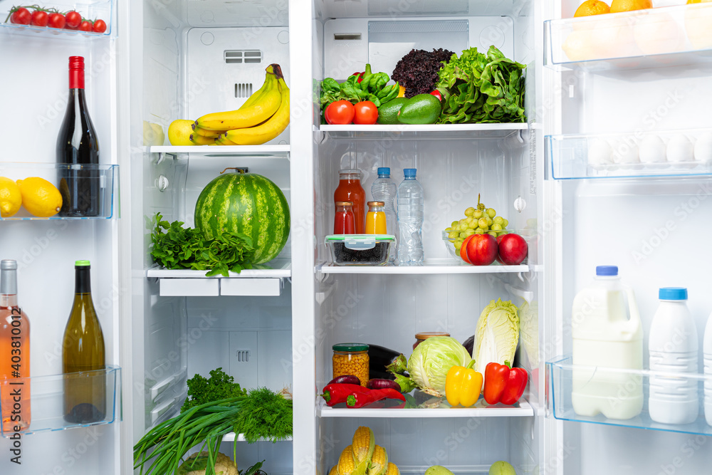 Open fridge full of fruits, vegetables and drinks - obrazy, fototapety, plakaty 