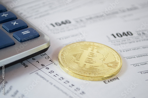 Bitcoin, ethereum and alternate cryptocurrencies coin symbol on tax form, crypto currency sign, future technology financial concept