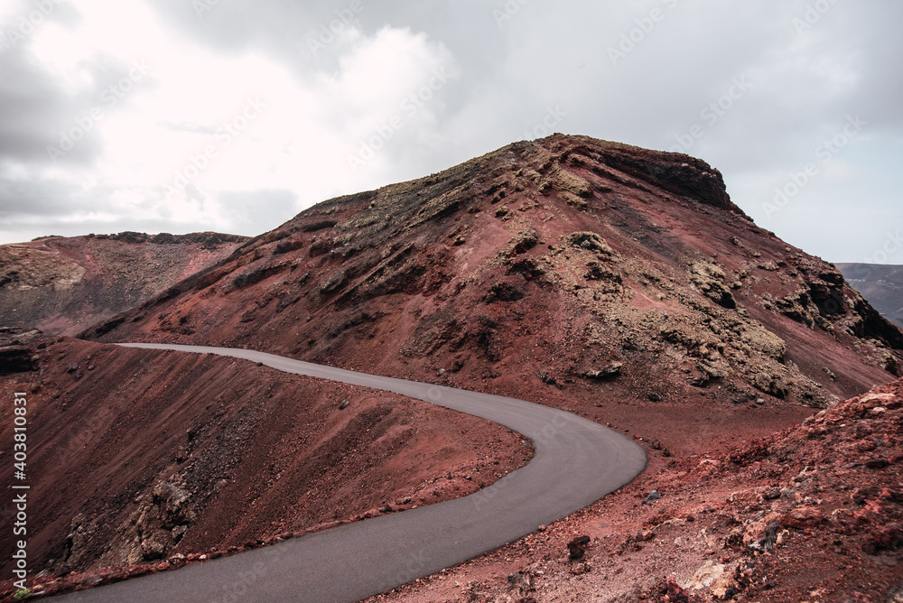 Lonely road in the middle of the Timanfaya National Park in Lanzarote