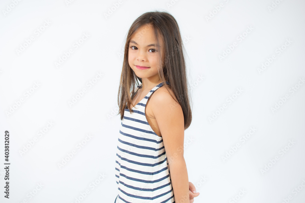 Enjoying vacation. Good vibes. Beach style. Little beauty. Portrait of happy cheerful girl over white background. Enjoying vacation. Good vibes. Beach style. Little beauty. Portrait of happy cheerful girl over white background.
