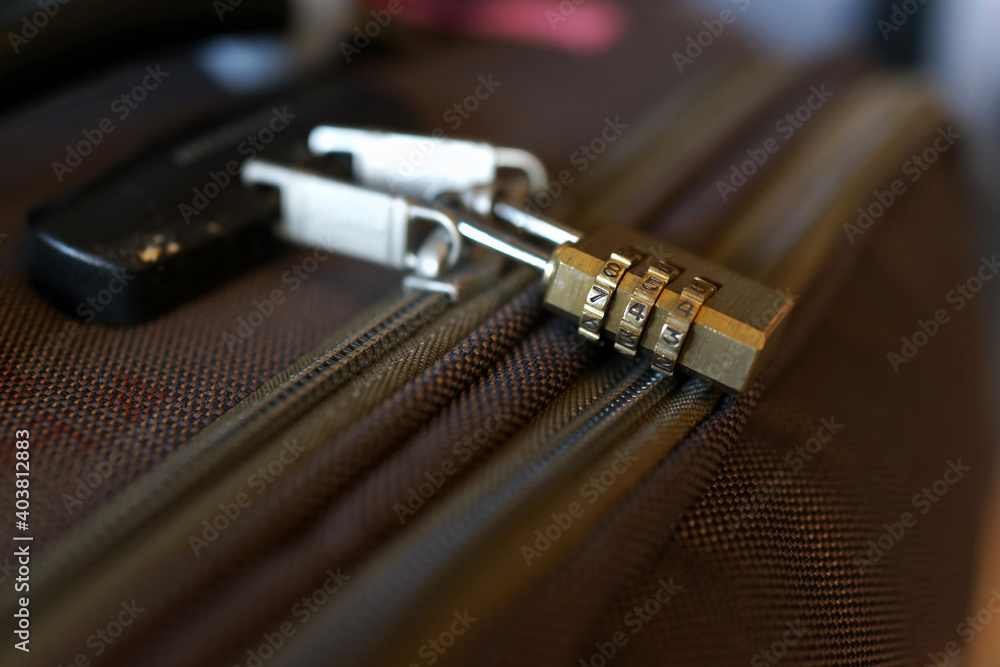 Closeup of a security combination padlock on luggage. Soft focus image. Closeup of a security combination padlock on luggage. Soft focus image.