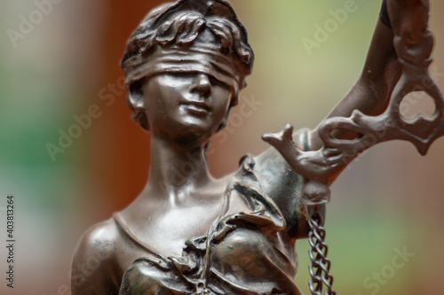 Blindfold on the eyes of Themis, a symbol of impartiality. Justice, court, human rights, advocacy, lawyering and education concept photo