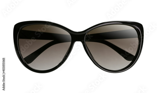 Elegant women`s sunglasses with a black plastic frame and dark lenses with folded temples isolated on a white background. Front view.
