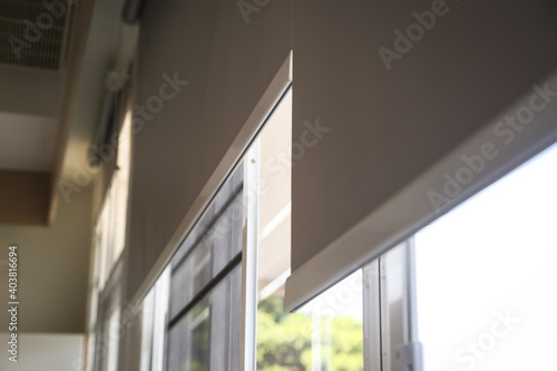 Canvas Print Details of white fabric roller blinds on the plastic window in the living room