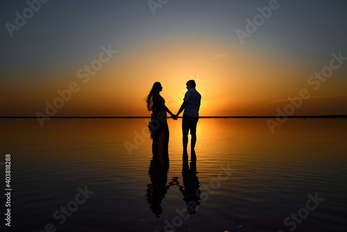 silhouette of a couple on the beach © Vitaliy Rutchin