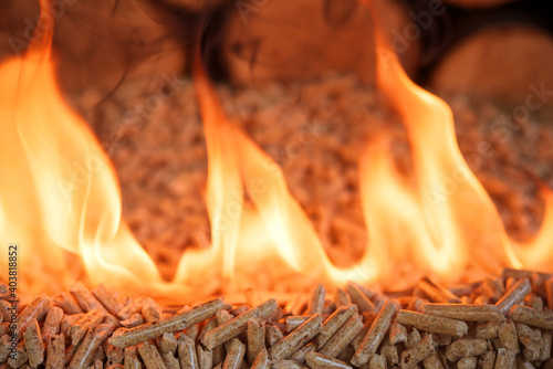 Pile of wood pellets, burning in flames