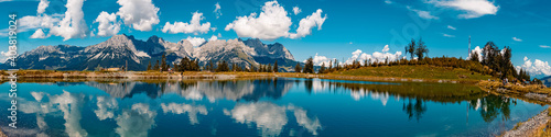 High resolution stitched panorama of a beautiful alpine summer view with reflections in a lake at the famous Astberg summit, Going, Wilder Kaiser, Tyrol, Austria photo