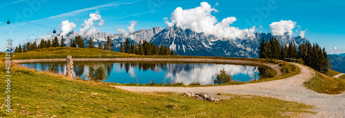 High resolution stitched panorama of a beautiful alpine summer view with reflections in a lake at the famous Hartkaiser summit, Ellmau, Wilder Kaiser, Tyrol, Austria