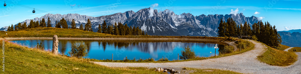 High resolution stitched panorama of a beautiful alpine summer view with reflections in a lake at the famous Hartkaiser summit, Ellmau, Wilder Kaiser, Tyrol, Austria