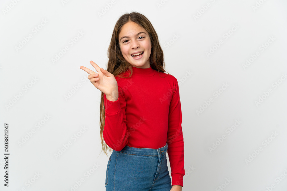 Little girl over isolated white background smiling and showing victory sign