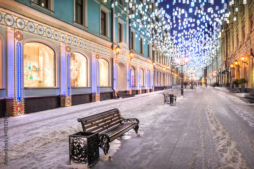 Glowing lanterns from the sky in Stoleshnikov Lane in Moscow
