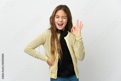 Little girl over isolated white background showing ok sign with fingers
