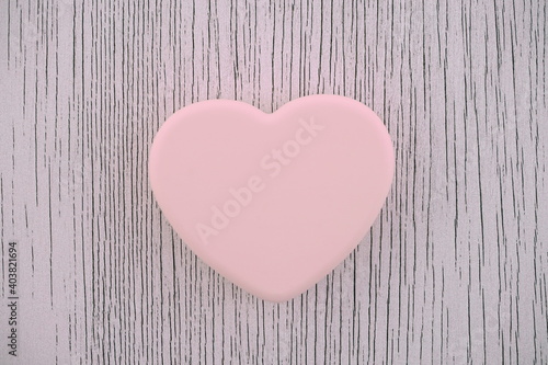 Pink heart on a gray background. Composition for Valentine s Day. Top view  copy space  flat lay.  