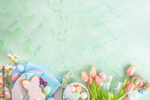 Canvas Print Happy Easter concept with easter eggs in basket and spring flowers